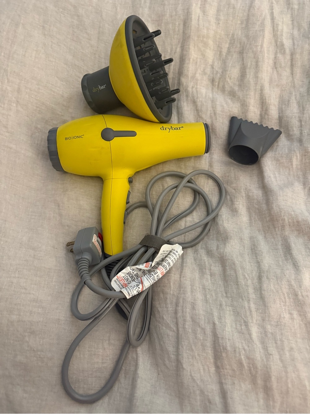 Drybar Yellow Hair Dryer with Diffuser and Nozzle Attachments